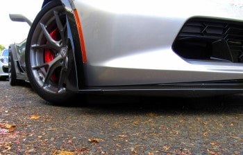 Bumper curb-scrape repair on a silver car